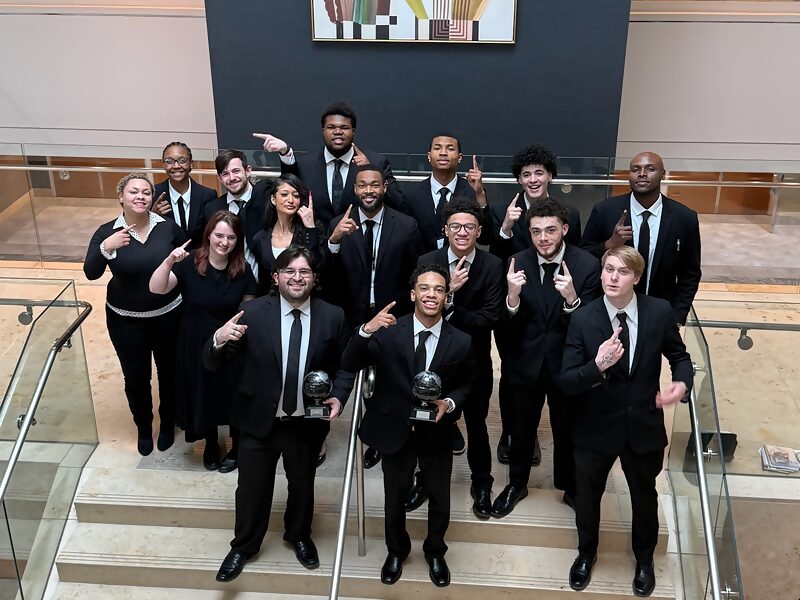 Dynamic Growth & Connections Inc. team members with awards at a company recognition event