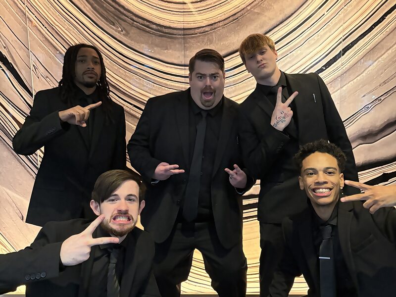 Five Dynamic Growth & Connections Inc. team members at a company event