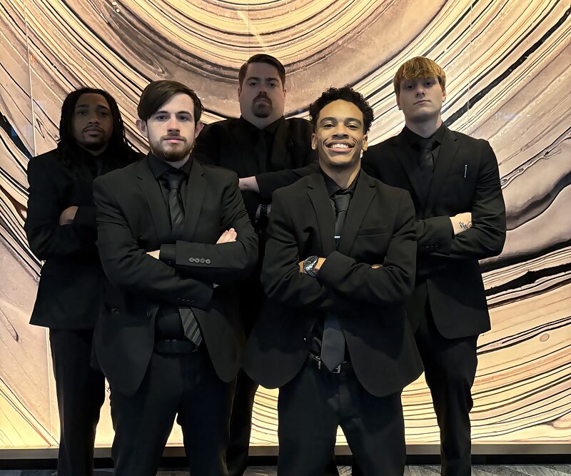 Dynamic Growth & Connections Inc. team members in business attire